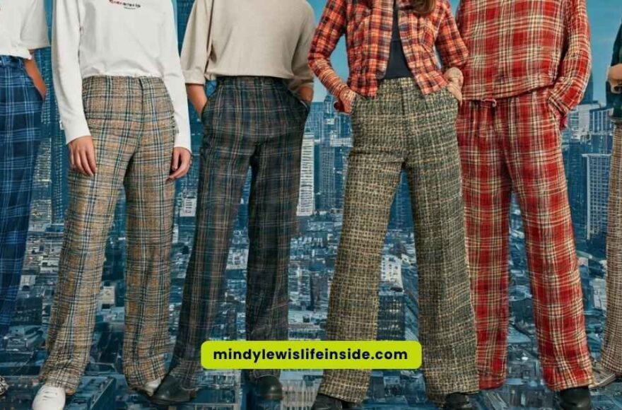 A group of four people wearing coordinated plaid outfits, highlighting the current style trend of plaid pants.