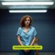 A woman stands in a jail cell, with the phrase "the girl on the train" displayed prominently above her.