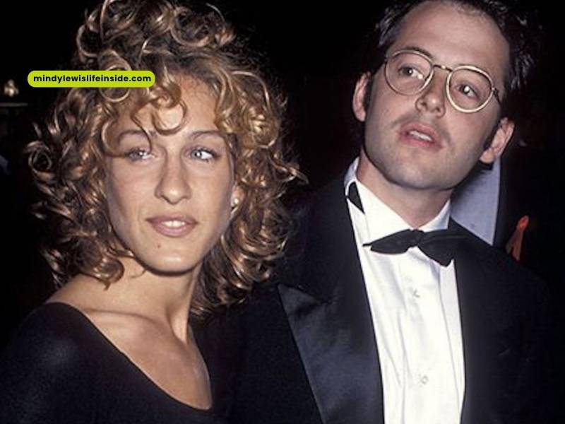 A couple in formal wear, the man in a suit and the woman in a gown, at a wedding celebration.