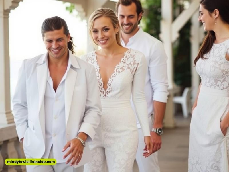 A man and woman in elegant white wedding outfits walking together, symbolizing love and unity on their special day.