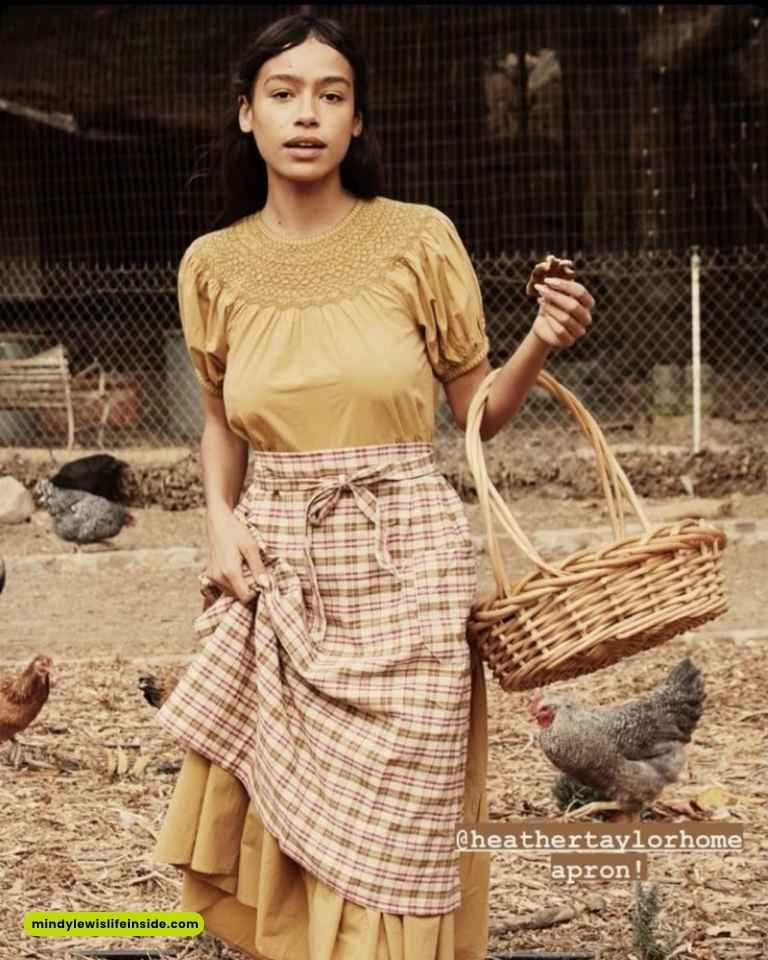 A woman in a yellow dress holds a basket, embodying a vibrant farm life aesthetic.