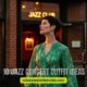A person in a green dress stands outside a brick jazz club, illuminated by warm lights. The text "10 Jazz Concert Outfit Ideas" is visible.