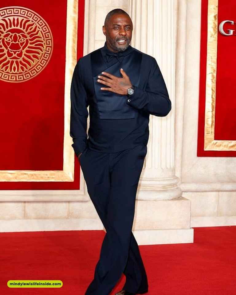Idris Elba at the British Academy Film Awards, dressed in a stylish outfit, exuding elegance and charisma on the red carpet.