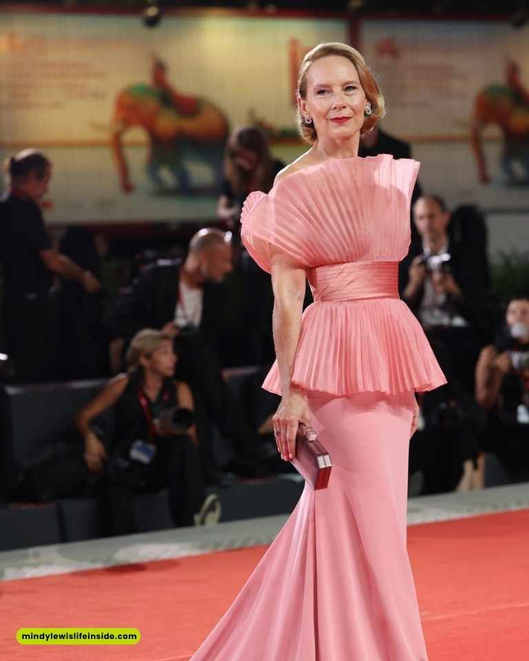 Cate Blanchett in a glamorous pink gown at the Venice Film Festival, embodying sophistication and celebrity fashion.