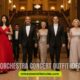Elegantly dressed people walk down a grand hallway with ornate lighting and pillars. Text overlay reads, "7 Orchestra Concert Outfit Ideas."