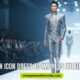 A male model walks confidently on a lit runway, wearing a sleek, metallic silver suit. The audience watches attentively. Text overlays the scene.