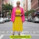 A woman in a vibrant yellow dress and pink blazer stands confidently on a city street, smiling. The scene conveys empowerment and style.