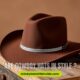 A brown cowboy hat with a silver band rests on a wooden surface, exuding a rustic feel. The text reads "Are Cowboy Hats in Style?" against a warm backdrop.